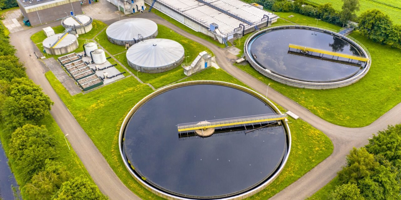 How are waste management and effluent treatment handled in the MLFAC Industrial Park?